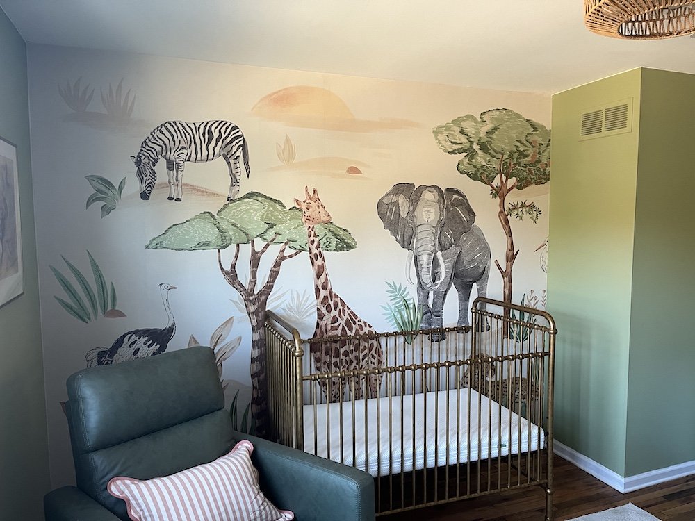 Wallpaper installer applying a patterned wallcovering in a residential interior